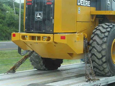 skid steer tie down rules